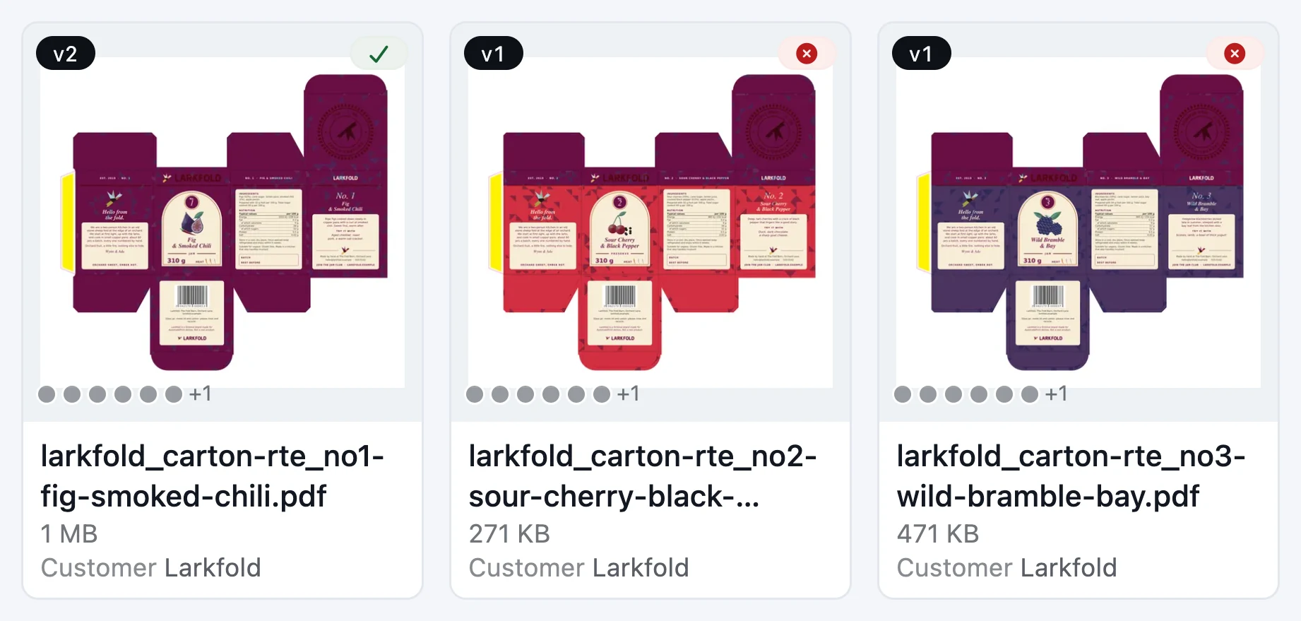 Three carton files in a grid, each with a thumbnail, a version badge, spot ink dots and a customer
